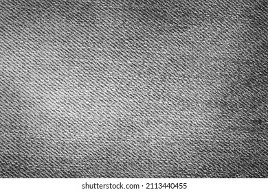 Black and grey denim background. Detailed texture of black and grey denim fabric.