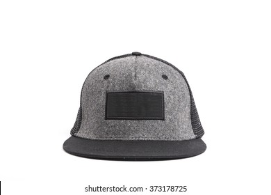 A black, grey fabric hat(cap) with mesh front side view for hip hop on the bottom isolated white.