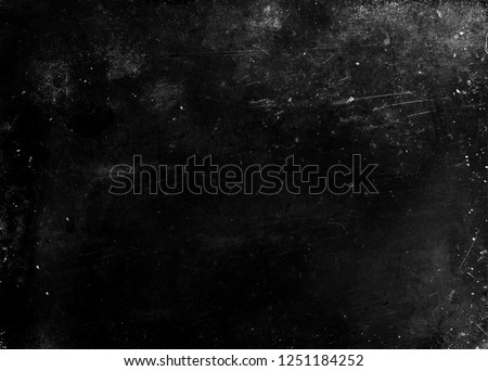 Black grunge scratched scary background, old film effect, dusty texture