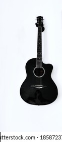 Black Guitar Hanging On The Wall