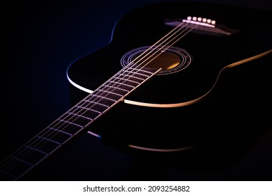 black guitar split colored concept. guitar music dark shoot