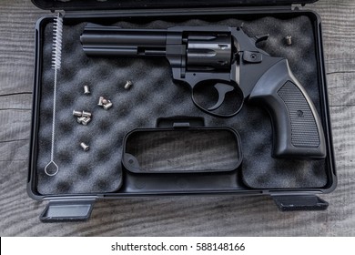 Black Gun In A Case. Gun With A Drum.