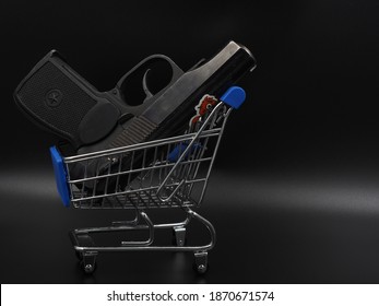 A Black Gun In A Shopping Cart. The Concept Of Weapons Reform. Black Market Weapons.