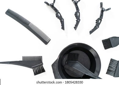 Black Hair Color Dye Kit With Mixing Bowl On A White Background.