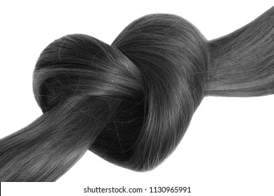 Black hair knot in shape of heart, isolated on white background. - Shutterstock ID 1130965991