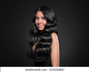 Black hair woman long curly beauty cosmetic concept over black background