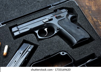 Black Handgun In Plastic Secure Storage Case