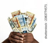 Black hands holding 3D rendered Jamaican dollar notes. closeup of Hands holding Jamaican currency notes