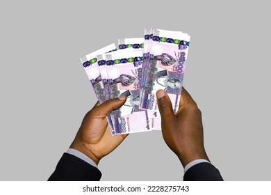 Black Hands in suit holding 3D rendered Cambodian riel notes - Shutterstock ID 2228275743