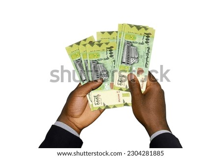 Black Hands in suit holding 3D rendered Yemeni Rial notes