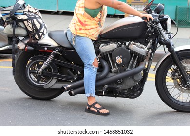 Black Harley Davidson, Woman Ride Black Harley Davidson Bike In The Crown Heights Section Of Brooklyn On A Sunny Summer Day August 2 2019