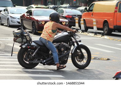 Black Harley Davidson, Woman Ride Black Harley Davidson Bike In The Crown Heights Section Of Brooklyn On A Sunny Summer Day August 2 2019