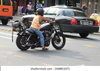 Black Harley Davidson, Woman Ride Black Harley Davidson Bike In The Crown Heights Section Of Brooklyn On A Sunny Summer Day August 2 2019