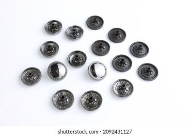 Black Hat Buttons For Clothes Of A Flat Shape On A White Background. Metallic Decorative Button For Bags And Outerwear. Sewing Accessories For Clothing And Accessories. Rivets 