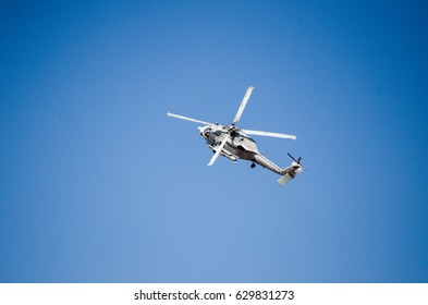 Black Hawk Uh 60 Helicopter Rescue Team Approach Landing, Exhaust Gas,  With Aviation Antennas On Mountain Background