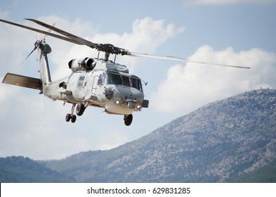 Black Hawk Uh 60 Helicopter Rescue Team Approach Landing, Exhaust Gas,  With Aviation Antennas On Mountain Background