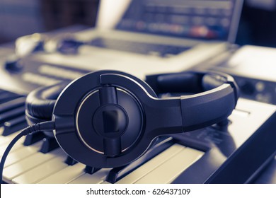 Black Headphone On Computer Music Home Studio Set Up