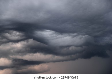 Black, heavy, undulating storm clouds. They are awe-inspiring, foreshadowing the arrival of sudden rains and life-threatening winds. - Shutterstock ID 2194940693
