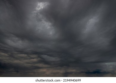 Black, heavy, undulating storm clouds. They are awe-inspiring, foreshadowing the arrival of sudden rains and life-threatening winds. - Shutterstock ID 2194940699
