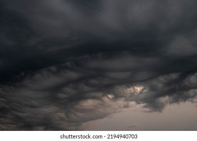 Black, heavy, undulating storm clouds. They are awe-inspiring, foreshadowing the arrival of sudden rains and life-threatening winds. - Shutterstock ID 2194940703