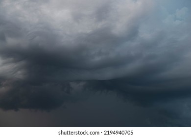 Black, heavy, undulating storm clouds. They are awe-inspiring, foreshadowing the arrival of sudden rains and life-threatening winds. - Shutterstock ID 2194940705