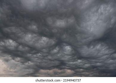 Black, heavy, undulating storm clouds. They are awe-inspiring, foreshadowing the arrival of sudden rains and life-threatening winds. - Shutterstock ID 2194940737
