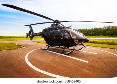 Black Helicopter On The Helipad