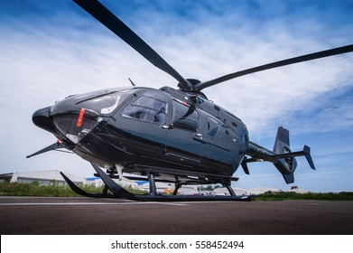 Black Helicopter On The Helipad