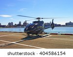 Black Helicopter on the helipad in Lower Manhattan in New York, USA, on East River. Pier 6.