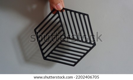 black hexagon placemat with shadow