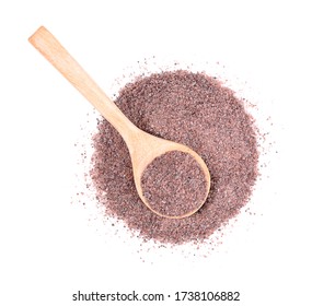 Black Himalayan salt (Namak shell salt) or Black salt of South Asia on a wooden spoon, isolated on a white background