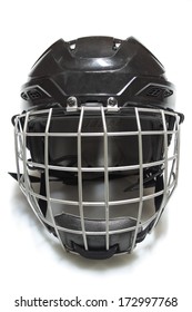 A Black Hockey Helmet With Cage On A White Background