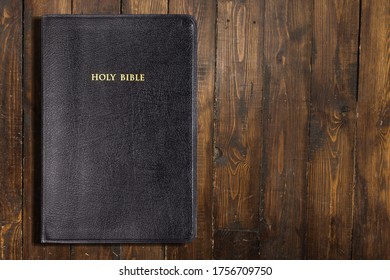 Black Holy Bible Book On A Desk