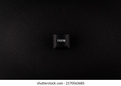 black Home button from keyboard on black background with copy space,  in concept of business and banking.
