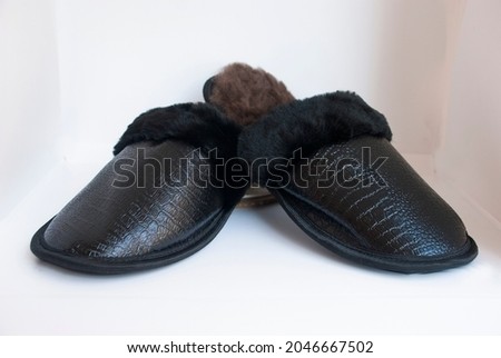 Black home shoes of sheep skin.