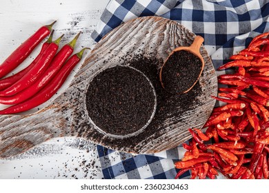 Black hot pepper spice. Chili pepper is a hot spice obtained by drying the pepper in the sun. Pounded and dried peppers isot used in turkish cuisine. Dry spice concept. local name isot.  - Powered by Shutterstock