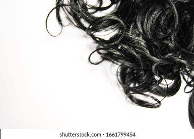 Black Human Hair Weaves. Wavy Ribbon Synthetic Ponytail Hair Extension. Beautiful Wallpaper. Top View,  Isolated On White. Hair Concept, Beauty Industry.