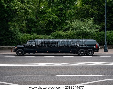 Black Hummer limo car, side view