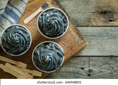 Black Ice Cream In White Cups