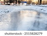 Black ice. Ice. The puddle is frozen. First frost.