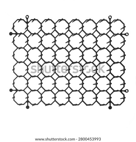 Black interlocking plastic anti-cat mat panel isolated on white background for humane garden and pet deterrent protection