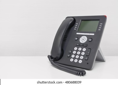 Black IP Phone on the white screen