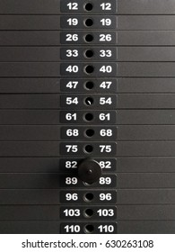 Black Iron Heavy Plates Stacked Of Weight Machine With Kilogram And Pound Number At Fitness Gym.