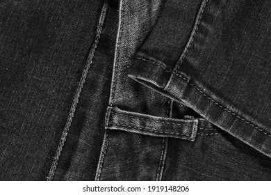 Black Jeans Fabric (denim). View Of The Waistband And Leg Stitches.