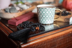 Black Jewellery Made Of Semi Precious  Stones, Bracelets And Japa Mala On The Table With Cup Of Coffee, Boho Style