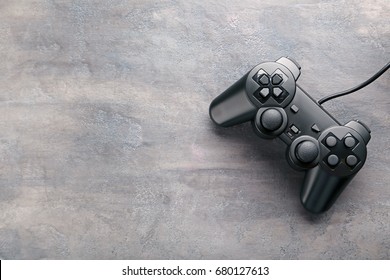 Black Joystick On A Grey Wooden Table