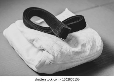 Black Judo, Aikido Or Karate Belt On White Judo Gi