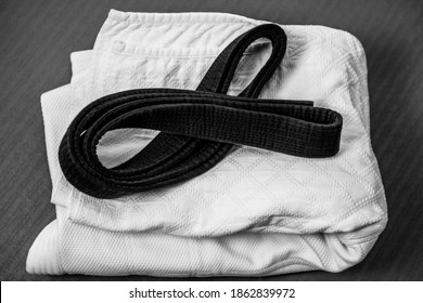 Black Judo, Aikido Or Karate Belt On White Judo Gi