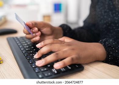 Black Keyboard From Computer, Desk In Office, Secretary, Woman Employee Tapping Fingers On Keys, Female Dark Skinned Hands, Holding Bank Card, Shopping Paying Online