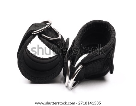 black kickback ankle strap for kickback machine isolated on white background, gym gluteus workout, fitness lifting weights